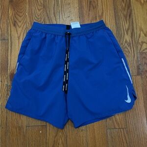 Nike blue running shorts with white swoosh, Size M #running #athleticwear